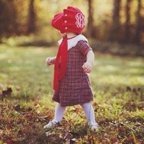 Baby in Plaid Dress Wearing Monogrammed Bonnet